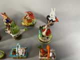 many figurines of different animals and animals on display