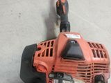 an image of a string trimmer on the floor