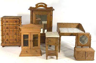 several pieces of furniture that are sitting on a white surface