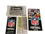 a football ticket and a ticket holder on a table