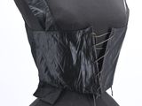 the back of a mannequin torso with a black corset on it