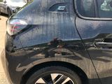 a black car that has been painted black and has a sticker on it