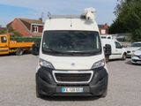 a white van that is parked in a parking lot