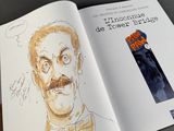 a drawing of a man with a mustache and a bow tie in a book