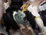 many pairs of shoes that are sitting in a basket
