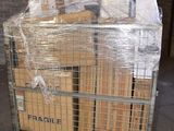 a cart full of boxes wrapped in plastic