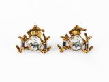 a pair of gold tone earrings with clear crystal stones