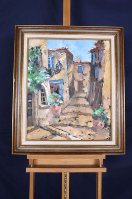 une peinture à l'huile représentant une scène de rue, posée sur un chevalet, avec une plante en pot