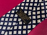 the tie is blue and white with a pattern on it