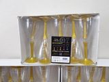 six wine glasses in a box on a shelf