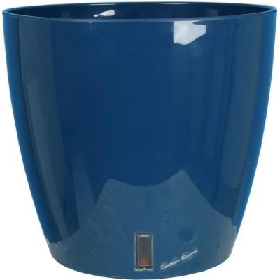 the large blue bowl is sitting on a white surface