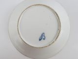 an empty plate with a blue and white design on it