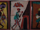 trois peintures représentant des Africains, réalisées sur un mur dans différentes couleurs