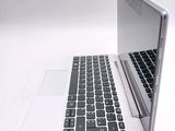 two laptops sitting side by side on a white surface
