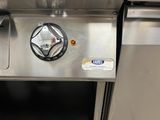 a close up of a stainless steel stove with a black knob