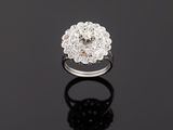 an 18k white gold and diamond cluster ring