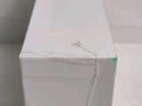 a close up of a white box with a string on it