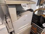 a pile of office equipment in a store with a price tag on the top of it