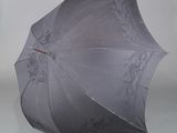 a black umbrella that is open on a white background