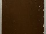 a brown piece of paper on the floor next to a brown piece of paper