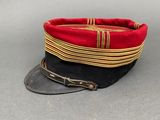 an image of a red and black hat sitting on top of a table