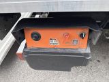 a close up of a truck ' s rear end with a box attached to it