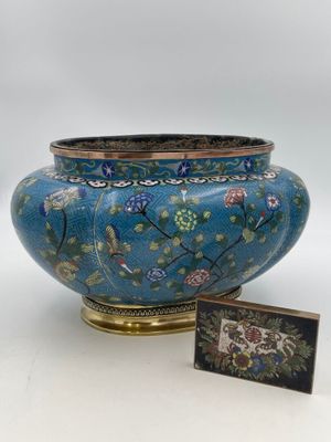 an image of a blue vase sitting next to a picture frame