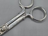 a close up of a pair of scissors on a table