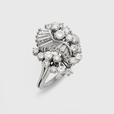 a close up of a diamond ring on a white background