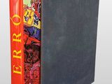 a black book with a red cover sitting on top of a table