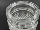 a glass candle holder with a diamond pattern on it