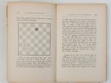 an open book with a picture of a chess game