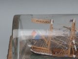 a model of a ship in a bottle on a table