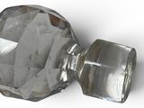 a glass knob with a clear facet on a white surface