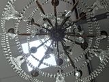 a chandelier hanging from the ceiling in a room