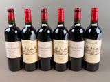 six bottles of red wine lined up in a row