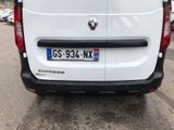 the back of a white van parked in a parking lot