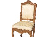 an image of a wooden chair with a beige upholstered seat