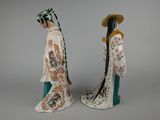 pair of chinese figurines of a man and a woman in kimono robes