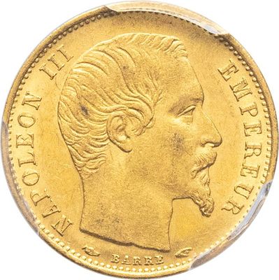 gros plan d'une pièce d'or portant un visage de femme