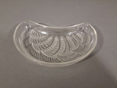 a glass bowl with a design on it on a table