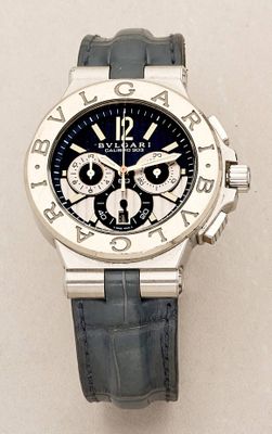 a close up of a watch on a white surface