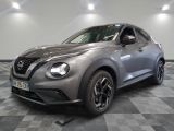the front of a silver nissan juke suv on a checkered floor