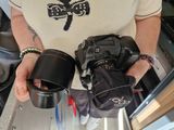 a woman holding a camera in her hands