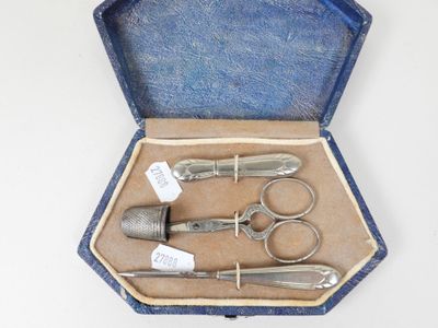 a case with a set of scissors and a pair of scissors