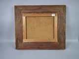 an old wooden picture frame with a cork board in the middle