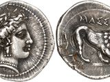 a silver coin with an image of a woman and a lion on it