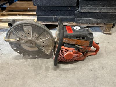 a picture of a saw and a circular blade on the floor