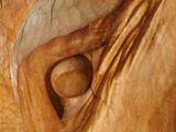 a wooden sculpture of an elephant with a hole in it ' s trunk