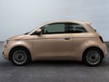 the small car is parked on the concrete floor in the room